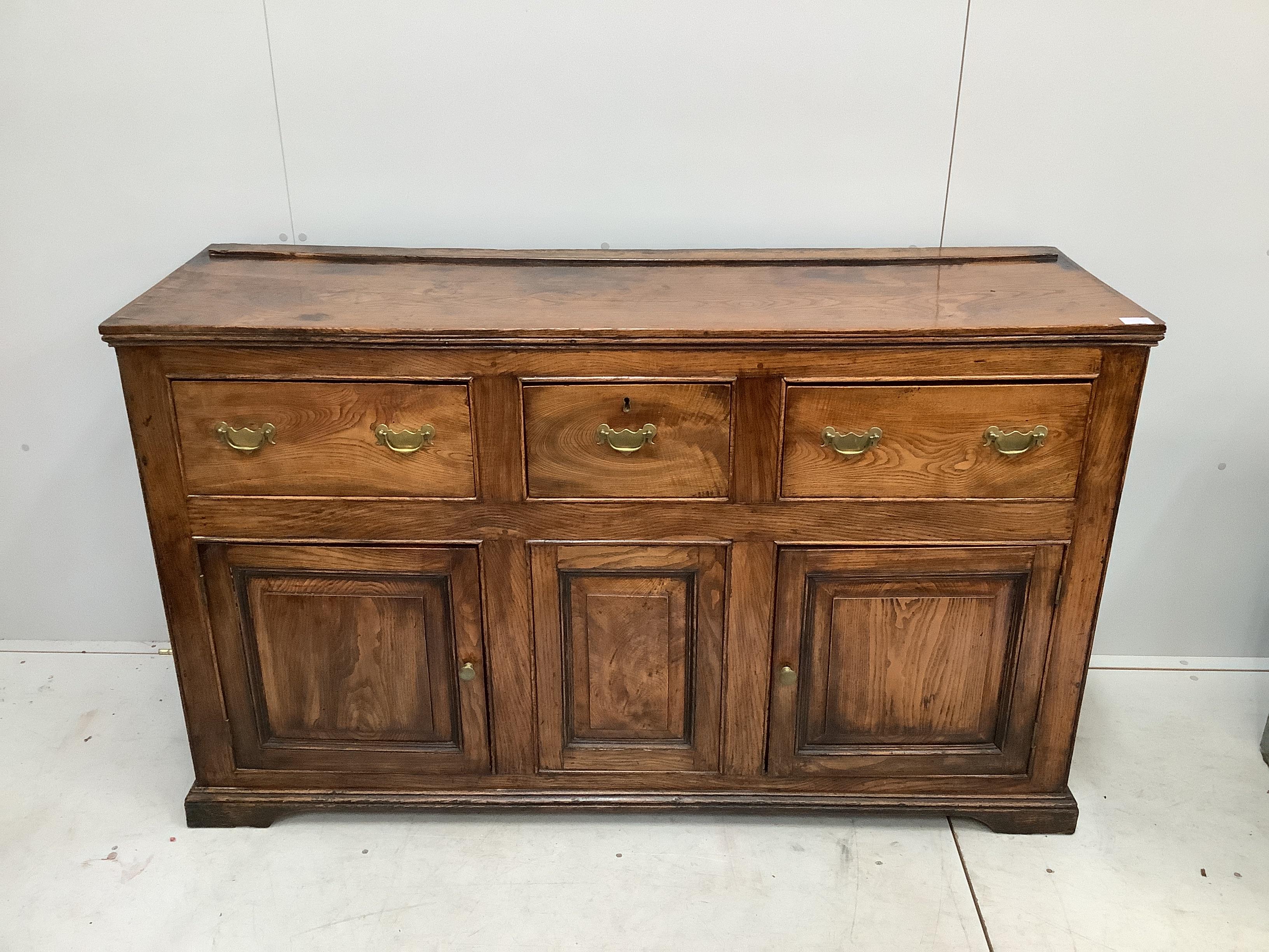 A late 18th / early 19th century elm low dresser, width 153cm, depth 48cm, height 92cm